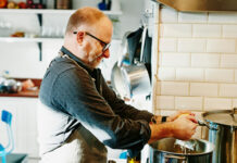 Man cooking at stove