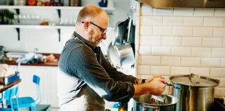 Man cooking at stove