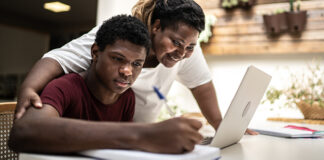Mom helping son with homework