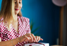Woman wrapping holiday gift