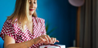 Woman wrapping holiday gift