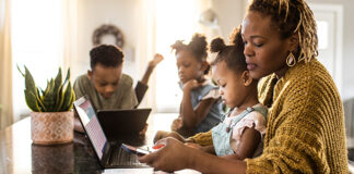 Family looking at a tablet.