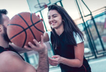 Young couple playing basketball