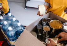 Volunteers packing up boxes of food