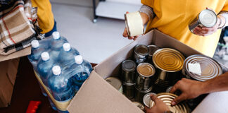 Volunteers packing up boxes of food