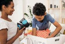 Mother and son packing donations.