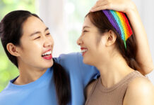 Two women smiling at each other