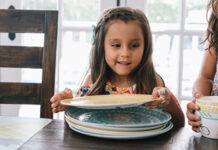 Children setting the dinner table