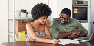 Man and woman looking at paperwork together