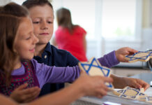 Kids decorating Hannukah cookies