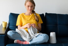 Woman knitting blanket