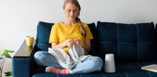 Woman knitting blanket