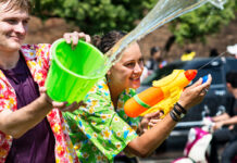 2 people having a water fight