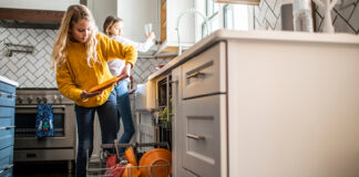 Kids emptying a dishwasher