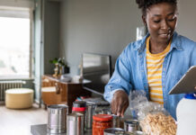 Woman preparing to cook with canned food ingredients