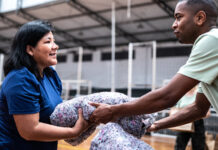 Two people handling disaster relief supplies