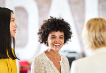 Three women talking to each other