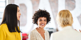 Three women talking to each other