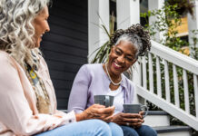 Two women sitting and chatting 