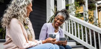 Two women sitting and chatting 