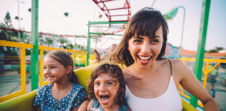 Woman and 2 children on rollercoaster
