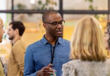 A group of people talking to each other